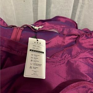 Purple off the shoulder, ruffled metallic shirt